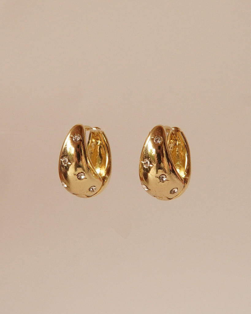 Gold Star Huggie drop earrings