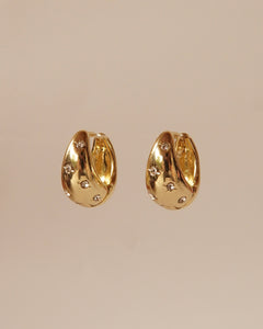 Gold Star Huggie drop earrings