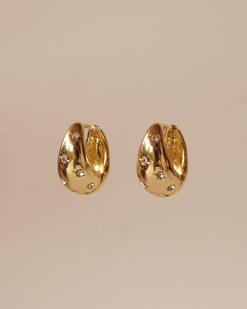 Gold Star Huggie drop earrings